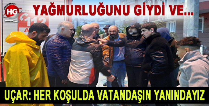 YAĞMURLUĞUNU GİYDİ VE...